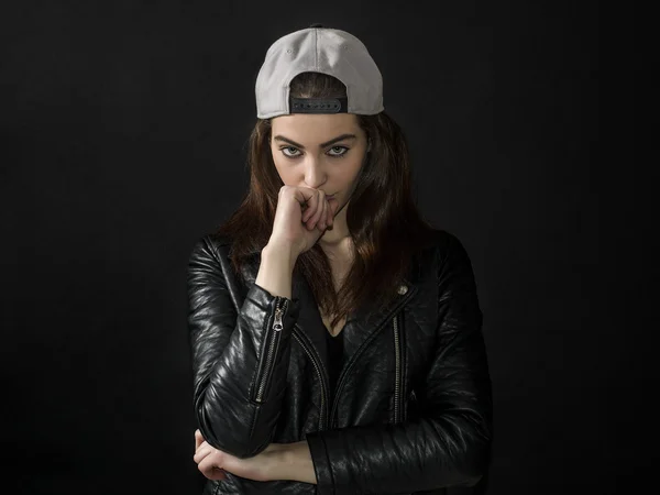 Pretty girl portrait wearing leather jacket and basket cap — Stock Photo, Image