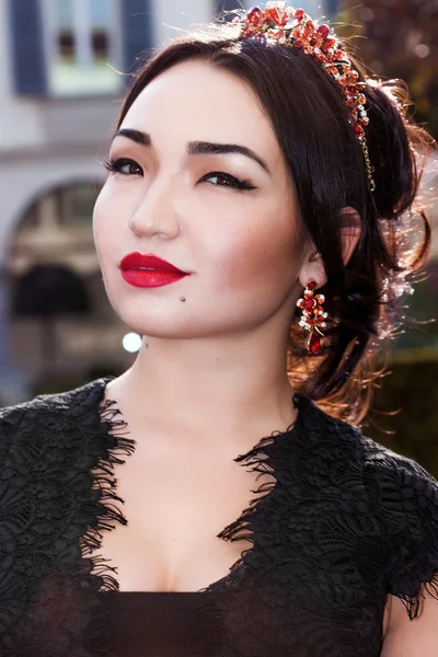 Pretty woman portrait wearing red tiara and lipstick — Stock Photo, Image