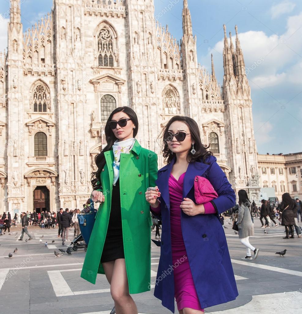 Stylish women portrait walking in Milan Cathedral Square