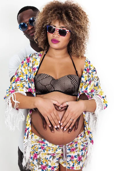 Cool and beautiful couple portrait holding pregnant belly — Stock Photo, Image