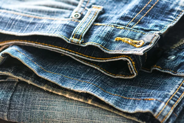 Trendy old worn rolled jeans — Stock Photo, Image