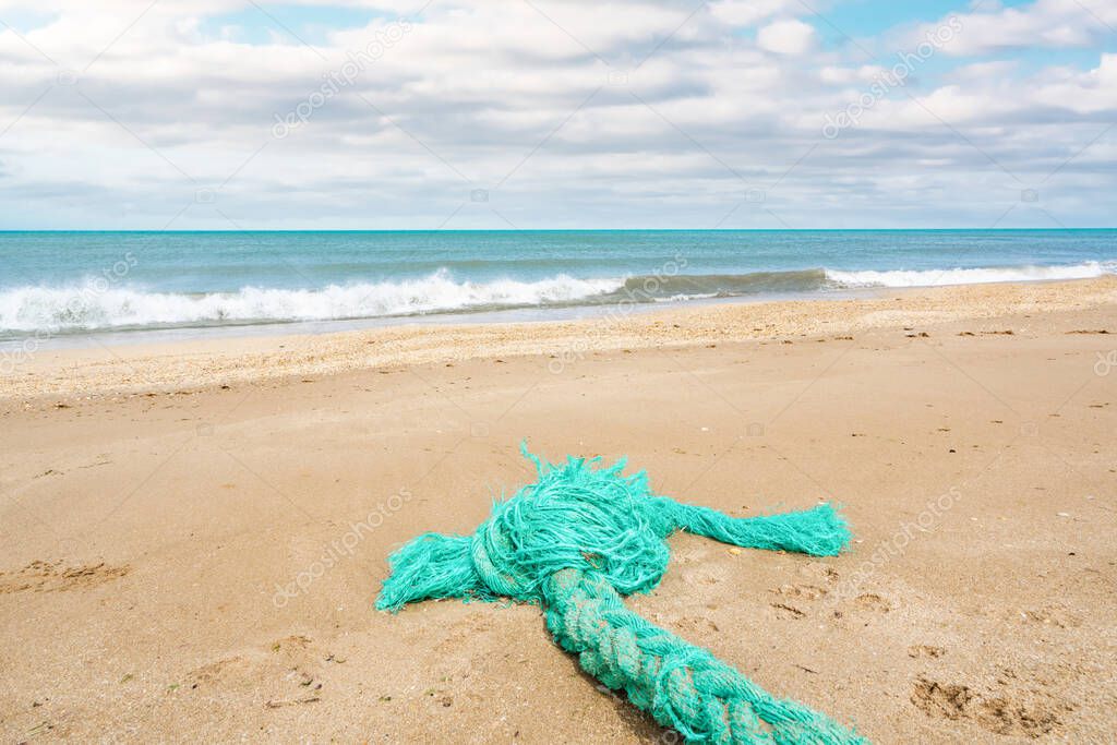 Abandoned fishing rope on the shore