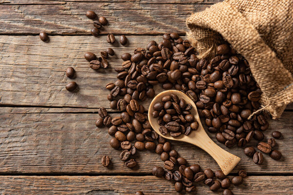 Coffee beans on wooden background