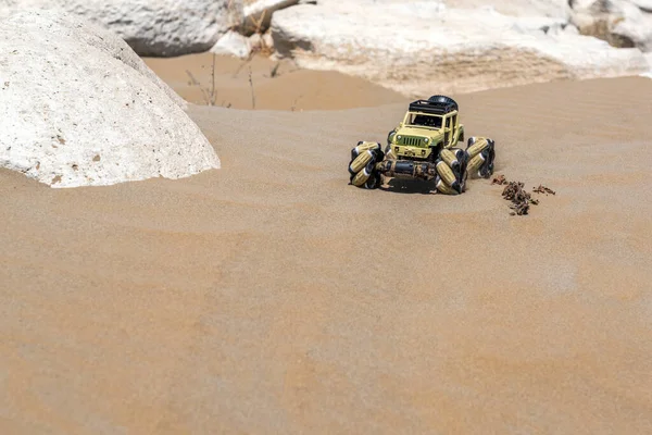 Radio controlled buggy car with electric engine on sand. Off road rally