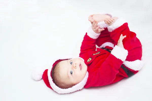 快乐宝贝躺在肚子穿红色和白色的圣诞圣诞老人隋 — 图库照片