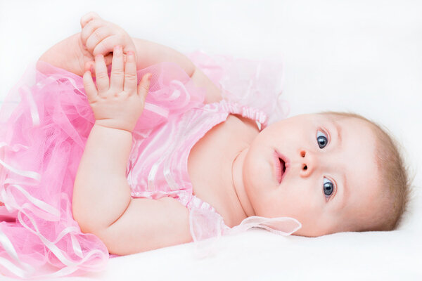 Baby girl wearing a pink dres