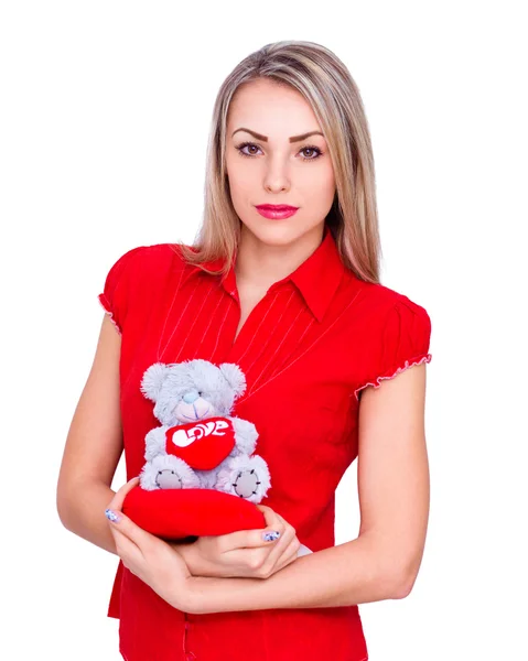 Beautiful girl in red clothes with bear on white background — Stock Photo, Image