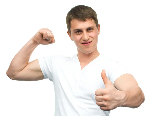 Happy smiling guy showing thumb up hand sign — Stock Photo, Image