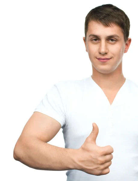 Young man shows thumb up gestur — Stock Photo, Image