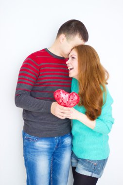 Valentine Couple. Portrait of Smiling Beauty Girl and her Handsome Boyfriend. Love Concept. Heart Sign. Happy Lovers