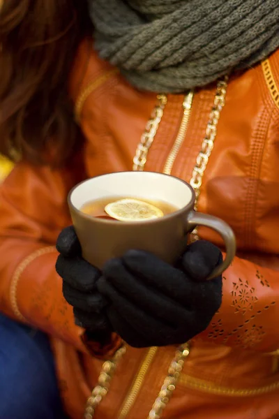 Female hands with hot drink