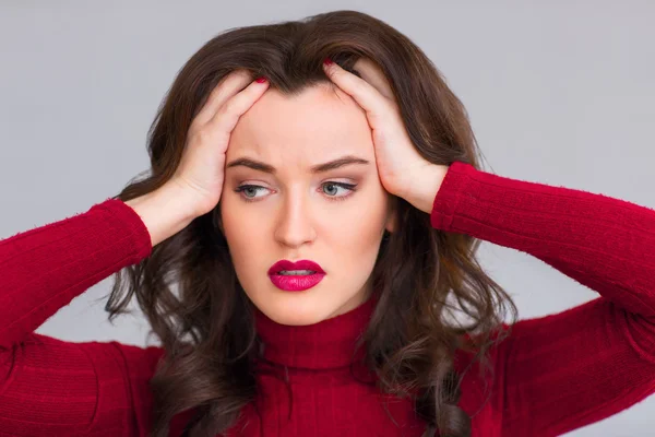 Exhausted woman touching her head — Stock Photo, Image