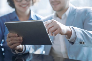 Positive worker holding tablet