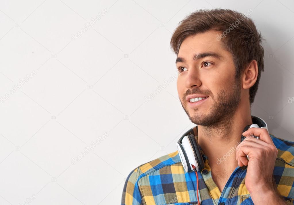 man is looking thoughtful with headphones