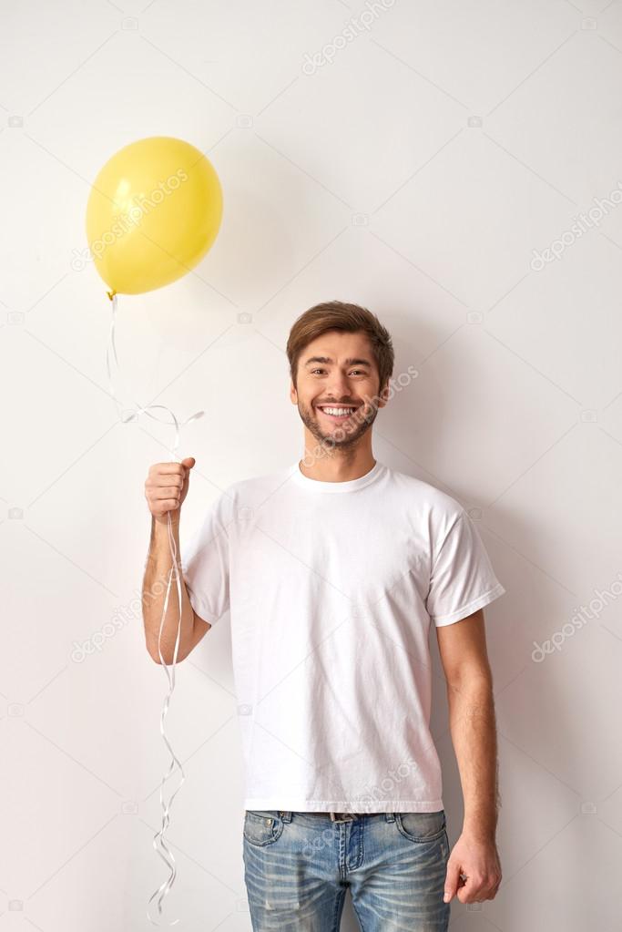 Mens Stamboom regiment Happy man holding a balloon Stock Photo by ©yacobchuk1 102476644