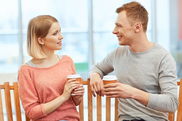 Pleasant friends drinking coffee. — Stock Photo, Image