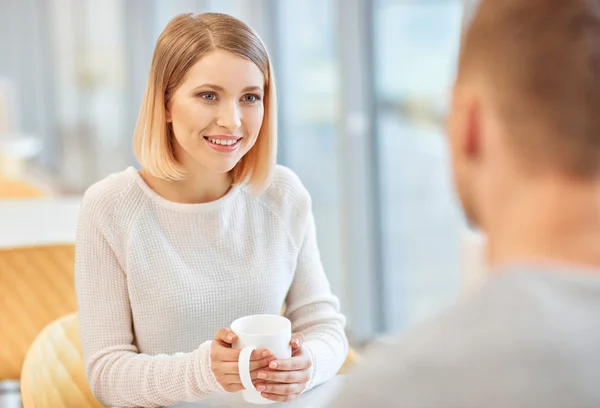 Positive students drinking coffee — Stock Photo, Image