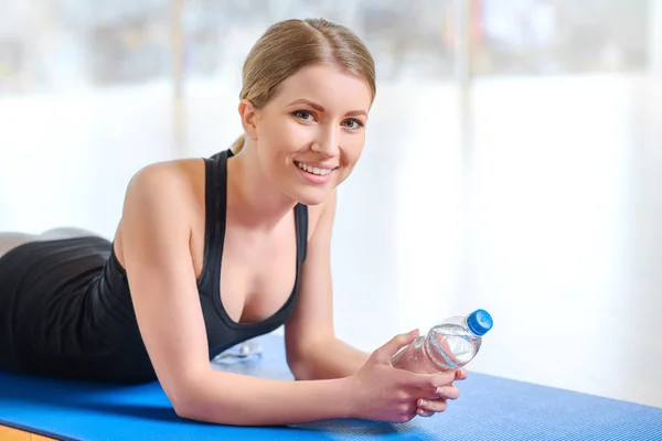 Cheerful girl resting after sport activities