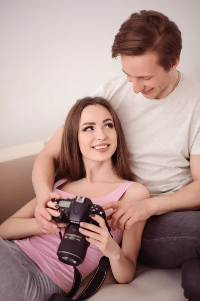 Pleasant couple resting on the couch — Stock Photo, Image