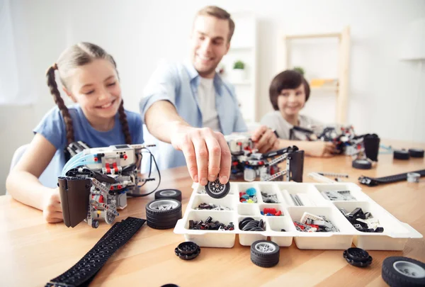 Smiling content  father playing with kids — Stock Photo, Image