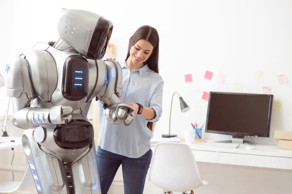 Delighted girl touching robot — Stock Photo, Image