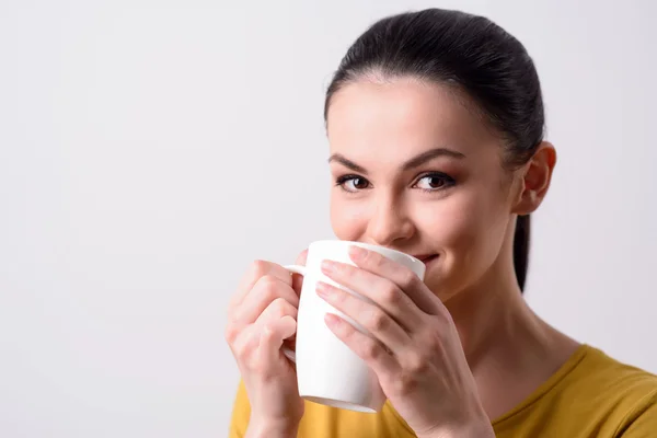 Positive girl drinking tea — Stock Photo, Image