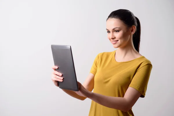 Nice girl using tablet — Stock Photo, Image