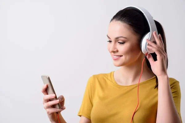 Delighted girl listening to music — Stock Photo, Image