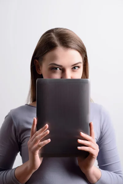 Positive girl holding tablet — Stock Photo, Image
