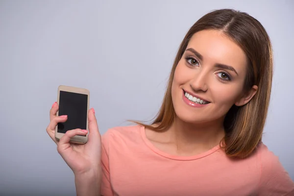 Pleasant woman holding cellphone — Stock Photo, Image