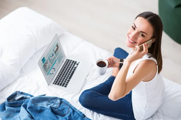 Joyful  beautiful woman resting in bed — Stock Photo, Image