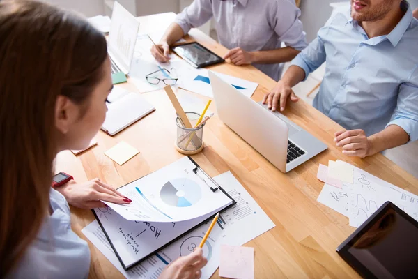 Involved busy colleagues sitting at the table — Stock Photo, Image