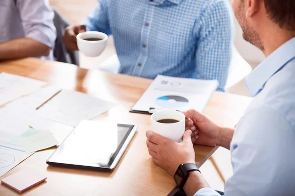 Pleasant colleague drinking coffee — Stock Photo, Image