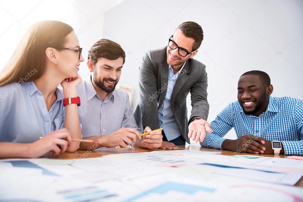 Professional cheerful colleagues working together Stock Photo by