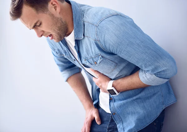 Sick moody man standing isolated o — Stock Photo, Image