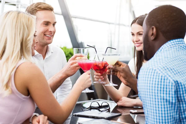 Positive friends sitting in the cafe — Stock Photo, Image