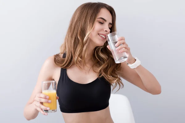 Positive delighted woman holding drinks — Stock Photo, Image