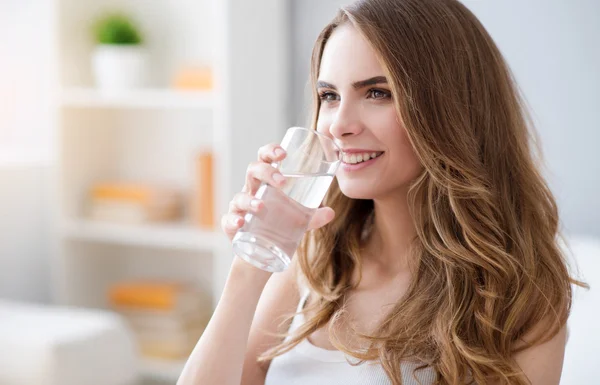 Positive woman drinking water — Stock Photo, Image