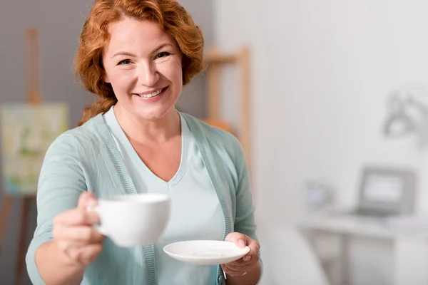 Cheerful woman drinking tea — Stock Photo, Image