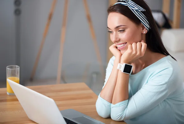 Pleasant beautiful woman using laptop — Stock Photo, Image