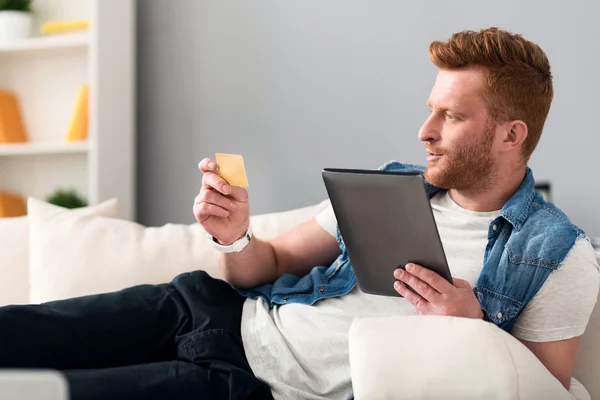 Pleasant Handsome man resting on the couch — Stock Photo, Image