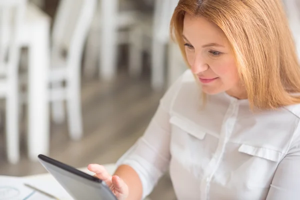 Pleasant content woman using tablet — Stock Photo, Image