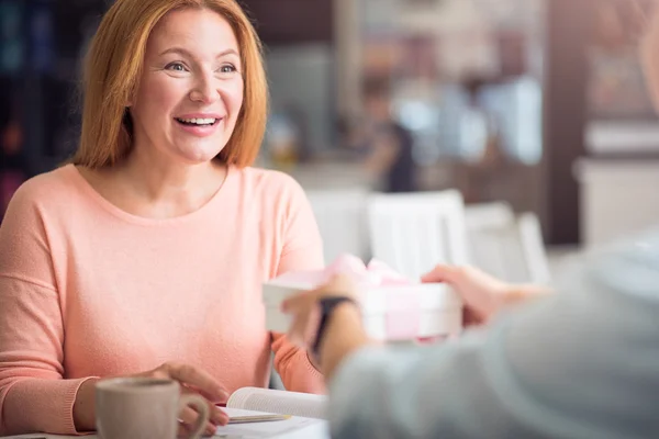 Positive women sitting at the table — Stock Photo, Image