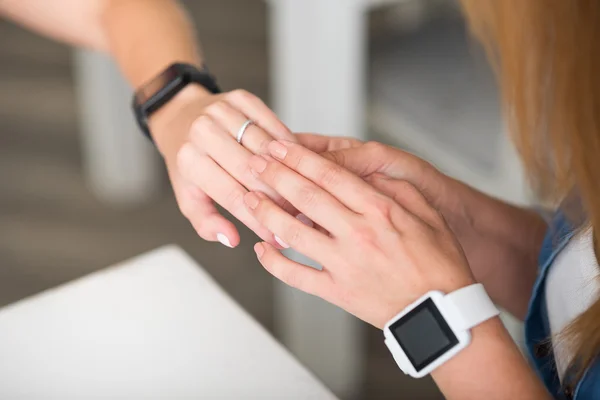 Pleasant daughter showing ring to her mother