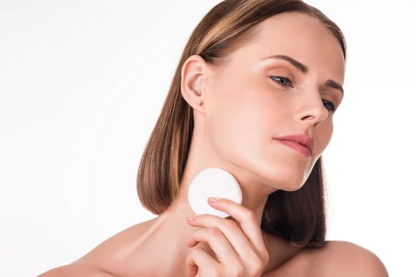 Cute young woman with cotton pad — Stock Photo, Image