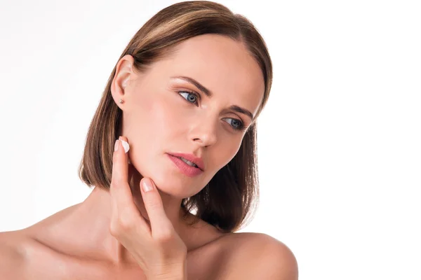 Attractive young woman applying lotion — Stock Photo, Image