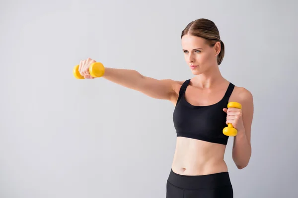 Mooie jonge vrouw met domme klokken — Stockfoto