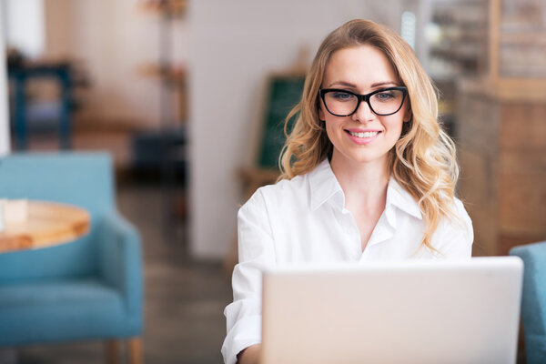 Attractive young woman using laptop