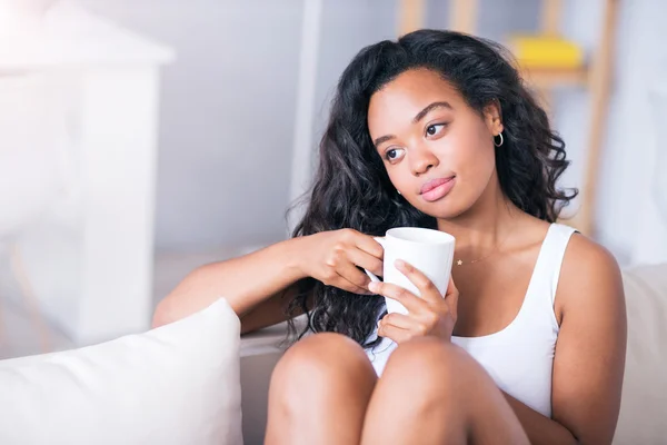 Pleasant romantic young woman drinking tea — Stock Photo, Image