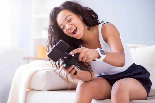 Joyful woman playing video games.